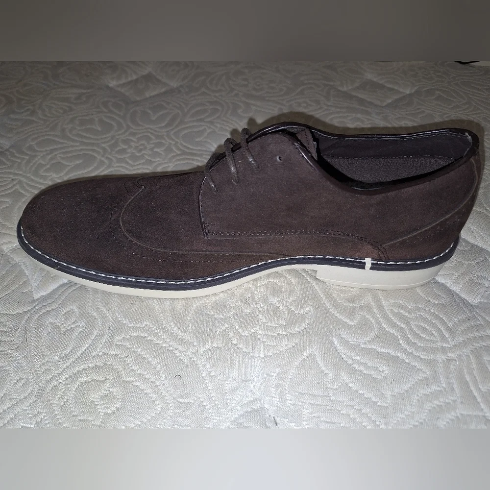 A pair of Franco Vanucci brown suede men's loafers in a size 10.5. EUC.